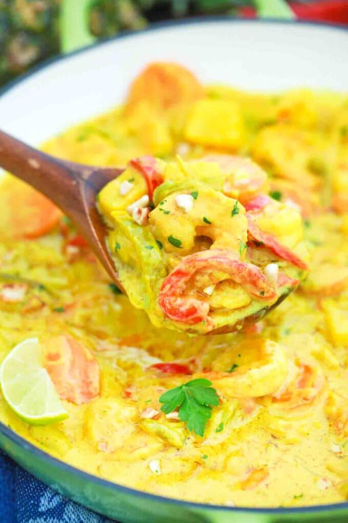 a spoonful of creamy pineapple coconut shrimp curry