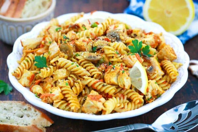 a bowl of indian curry pasta salad with fusili pasta