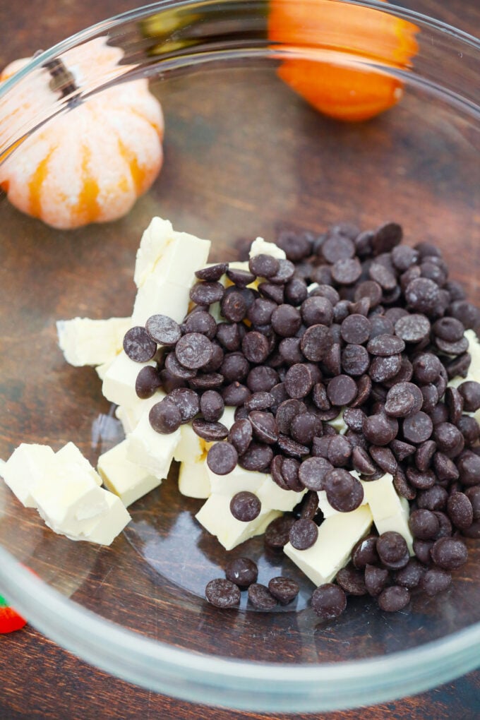 Chocolate chips and butter in a bowl.