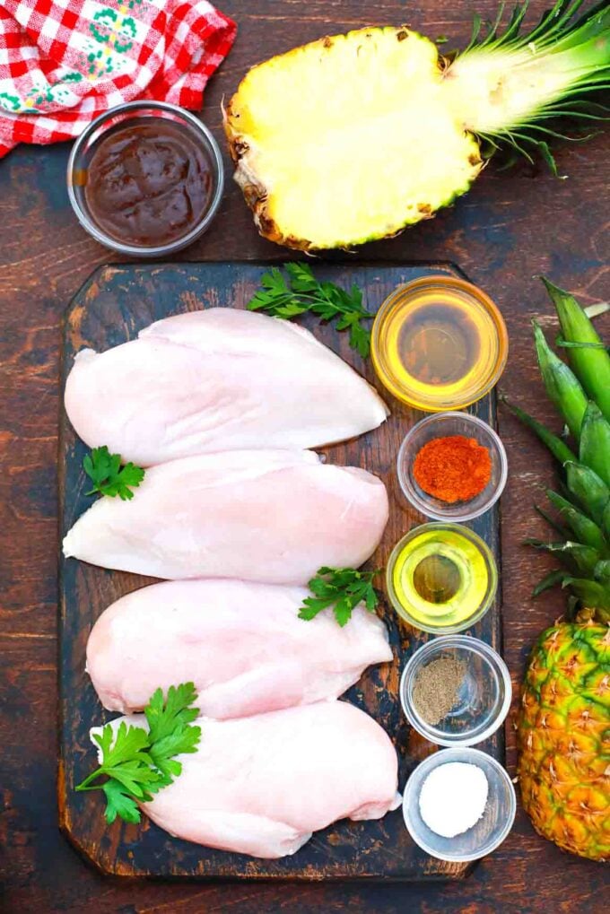 overhead shot of chicken breasts on a cutting boards