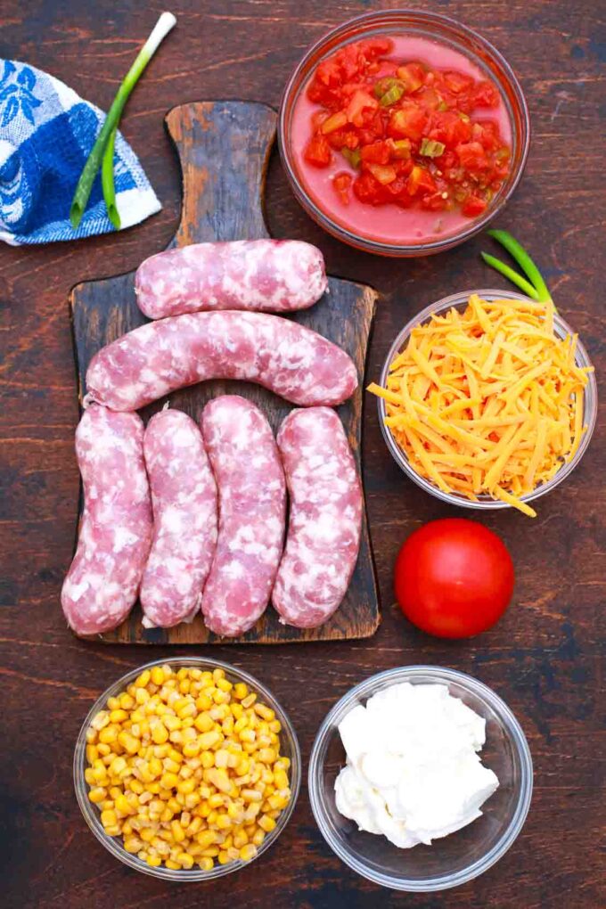 overhead shot of sausage cheese corn diced tomatoes on a table