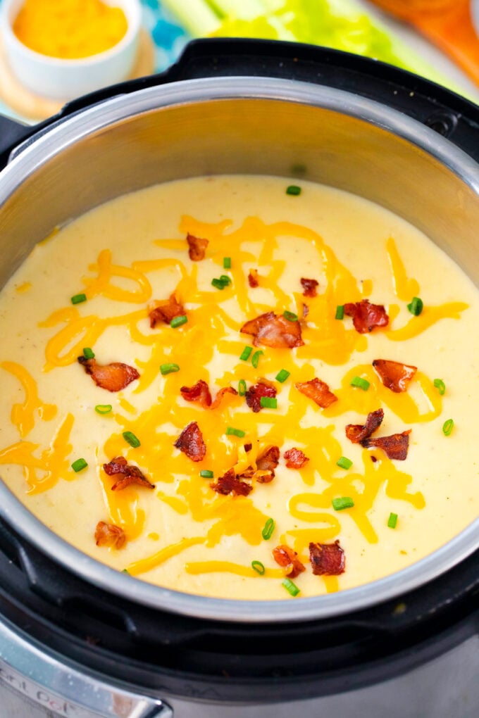 Instant Pot loaded baked potato soup with cheddar cheese and bacon.