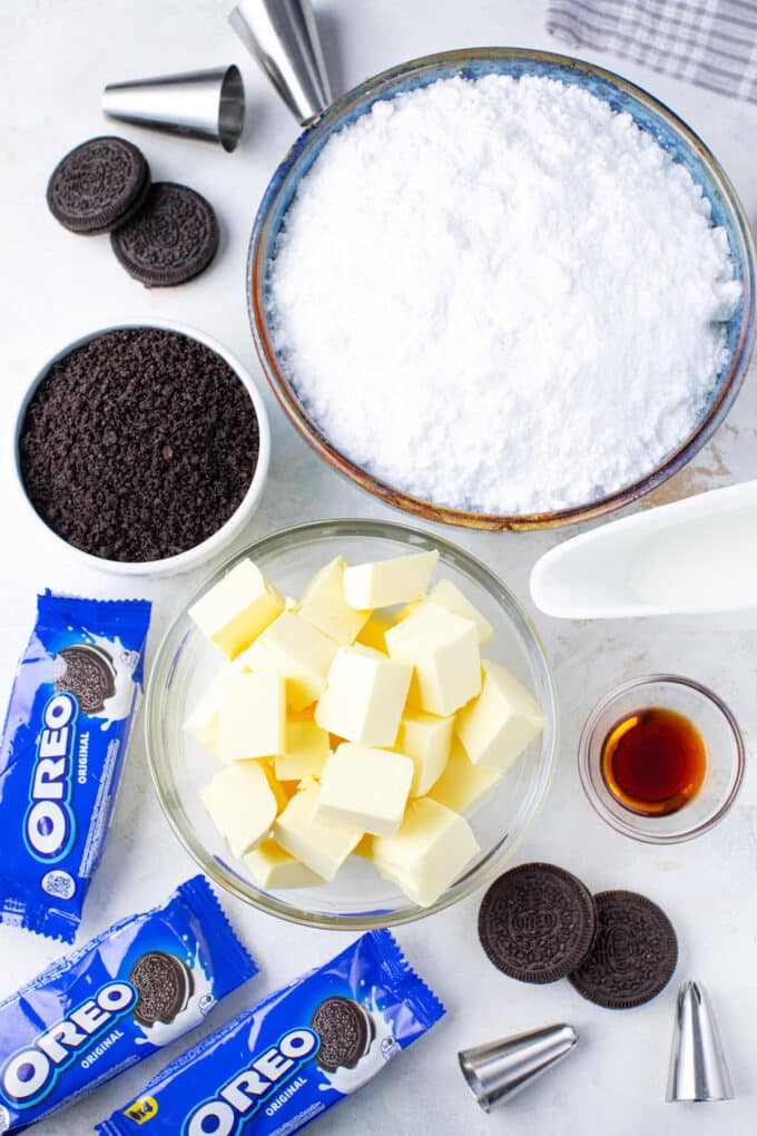 Overhead shot of Oreo buttercream ingredients in bowls on a table.