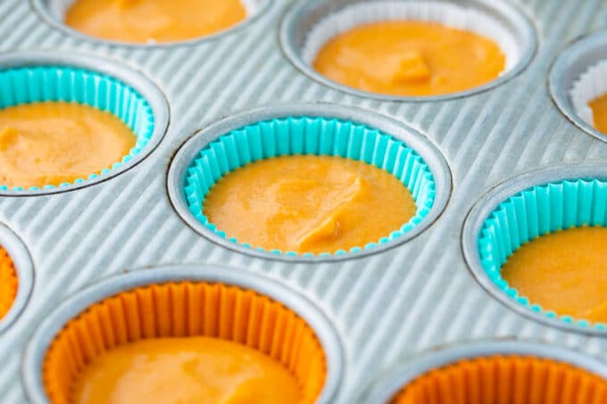 Sweet potato pie cupcake batter in muffin tins.