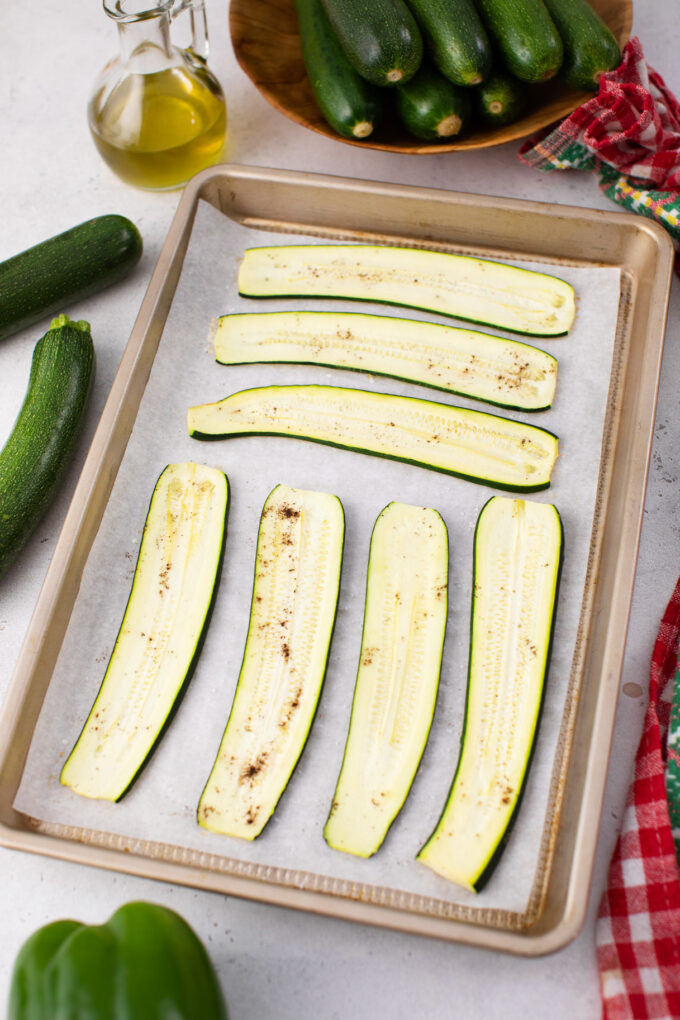 Zucchini slices on a baking dish.