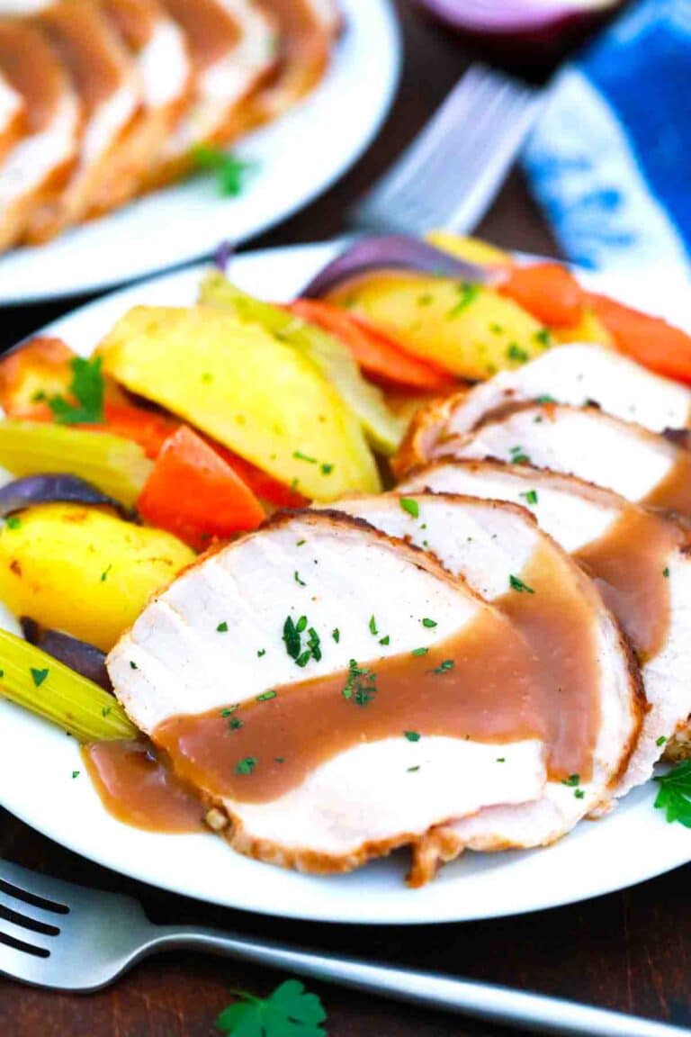 sliced maple pork roast drizzled with gravy