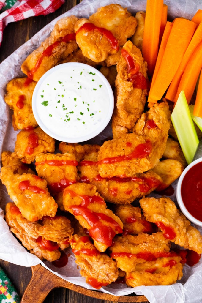 Overhead shot of a platter of crispy boneless chicken wings.