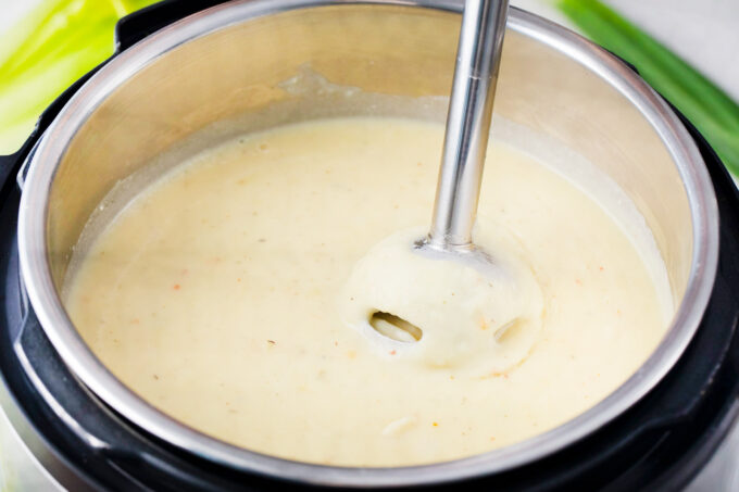 Blending Instant Pot loaded baked potato soup.
