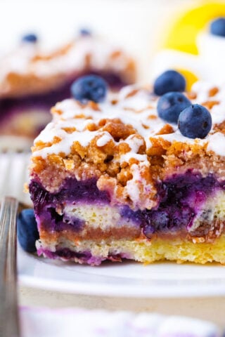 A close shot showing the layers of a blueberry coffee cake.