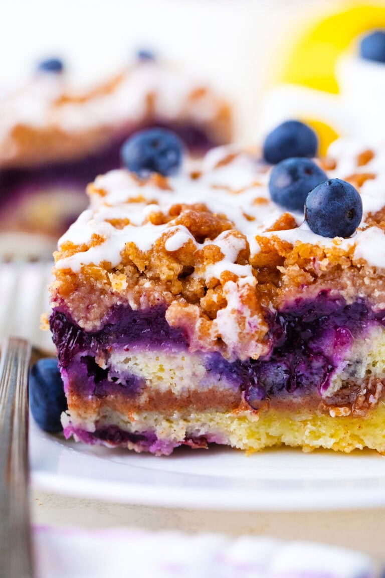 A close shot showing the layers of a blueberry coffee cake.