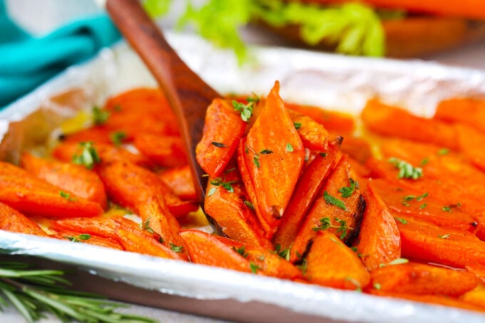 A serving plate with brown sugar roasted carrots.