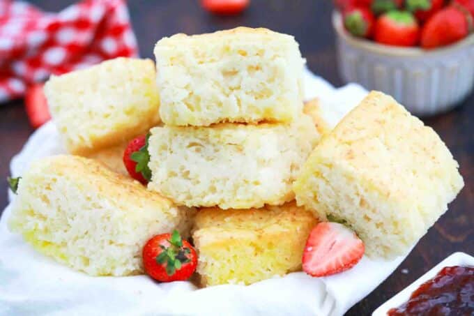 a plate of butter swim biscuits and fresh strawberries