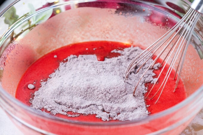 Mixing red velvet cake batter.