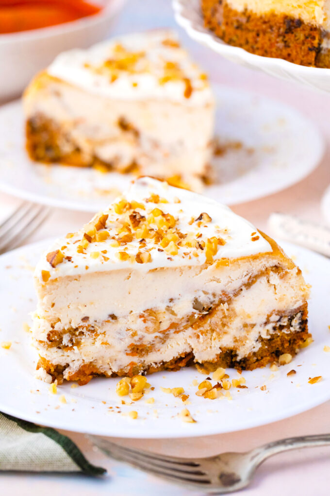 A sliced of swirled carrot cake cheesecake.