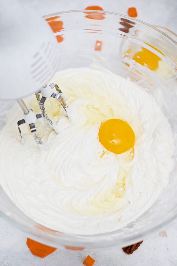 Whipping the cheesecake batter.
