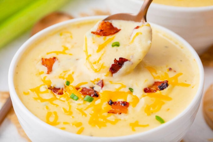 A spoonful of Instant Pot loaded baked potato soup with bacon.