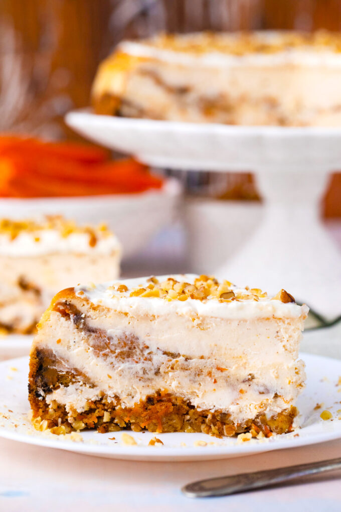 A slice of swirled carrot cake cheesecake.