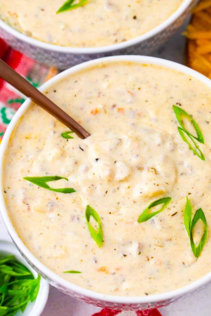 a bowl of cheeseburger soup with ground beef