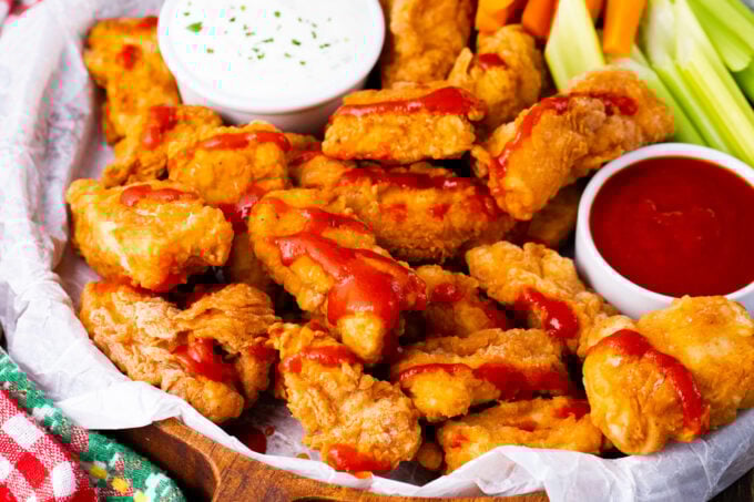 Crispy boneless chicken wings with ketchup and Ranch.