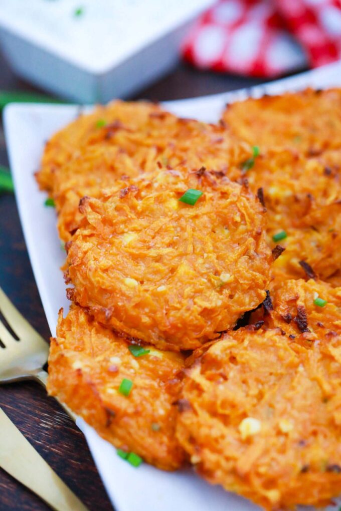 A plate of crispy oven-baked sweet potato fritters.