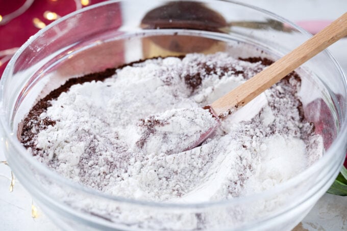 Mixing dry ingredients for red velvet cake.