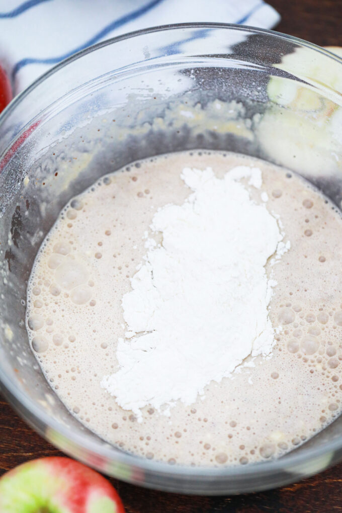 Adding flour to wet ingredients.
