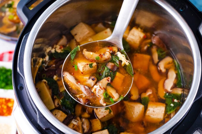 A ladle of Instant Pot hot and sour soup.