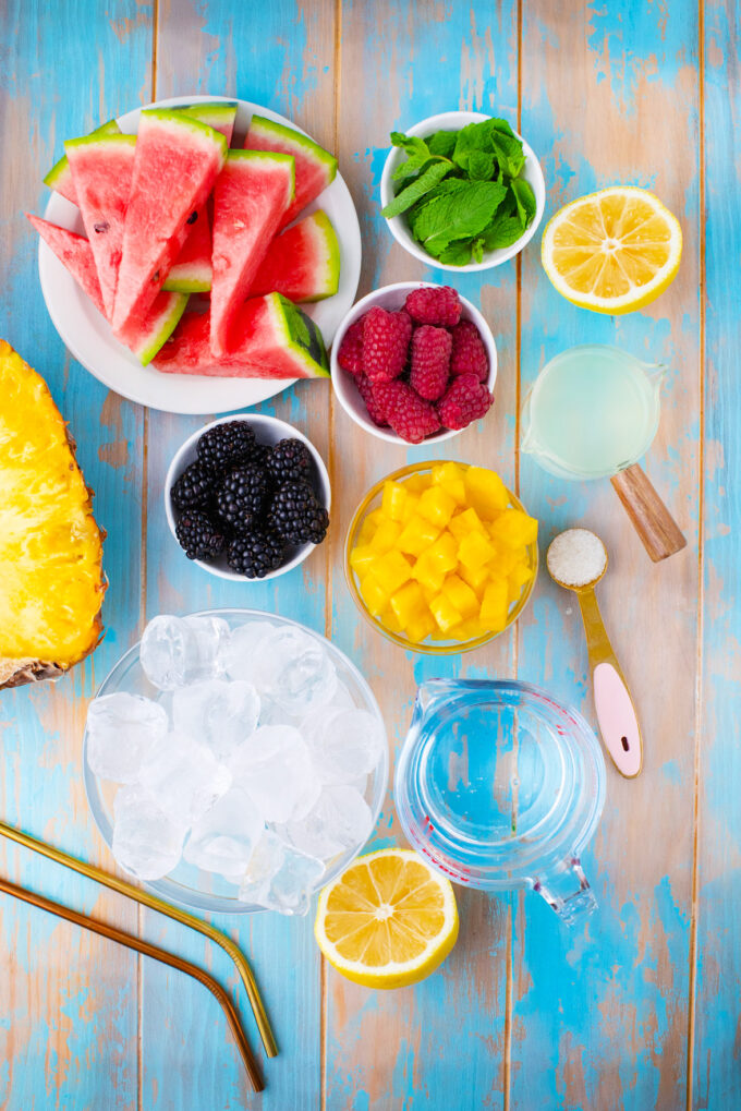 Overhead shot of fruit mojito recipe ingredients.