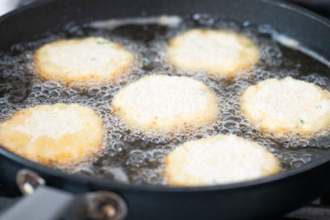 Frying crab cakes.