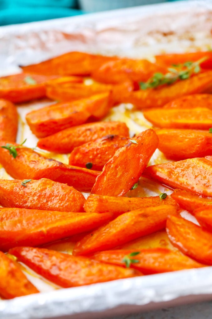 Brown sugar roasted carrots on a baking sheet.