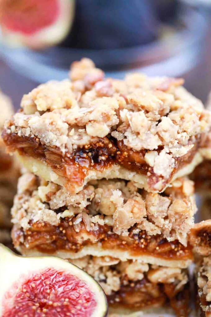 stack of fig bars top one with a bite reveling the filling