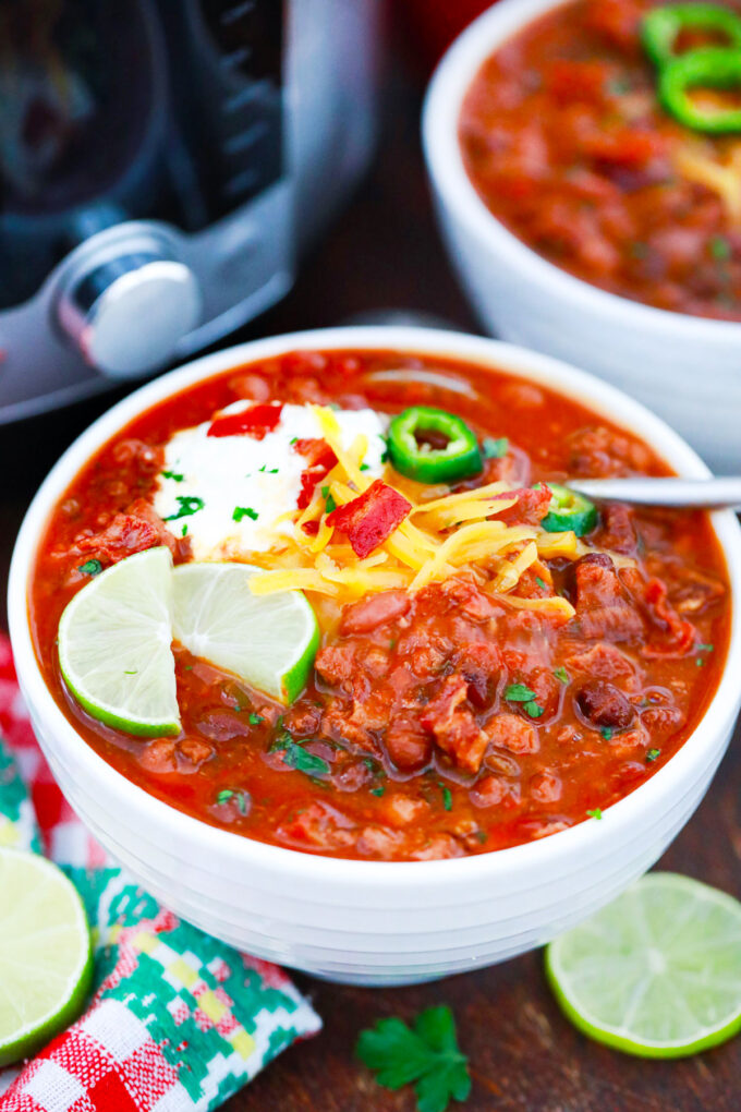 A bowl of instant pot turkey chili with beans.