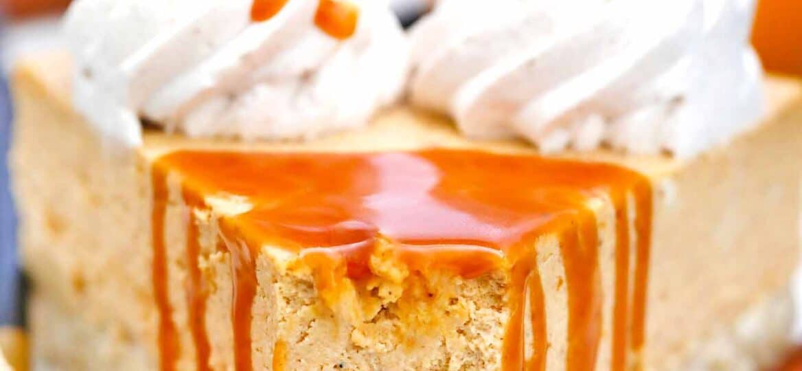 close shot of low carb pumpkin cheesecake with caramel dripping