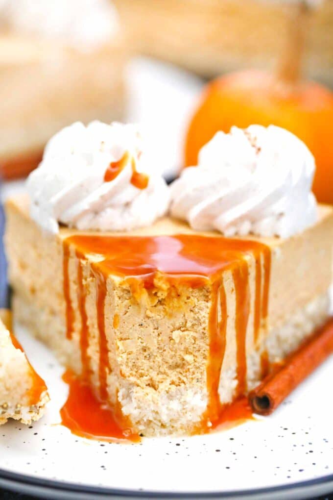 close shot of low carb pumpkin cheesecake with caramel dripping