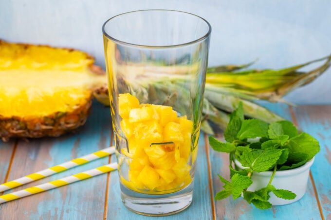 Making pineapple mojito.