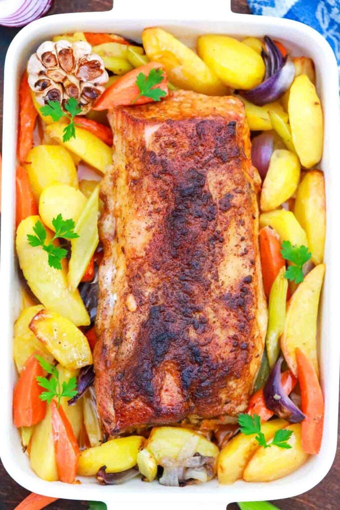 overhead shot of maple pork roast with veggies in a baking dish