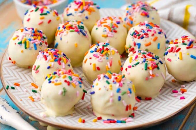 a plate of no bake cake batter truffles