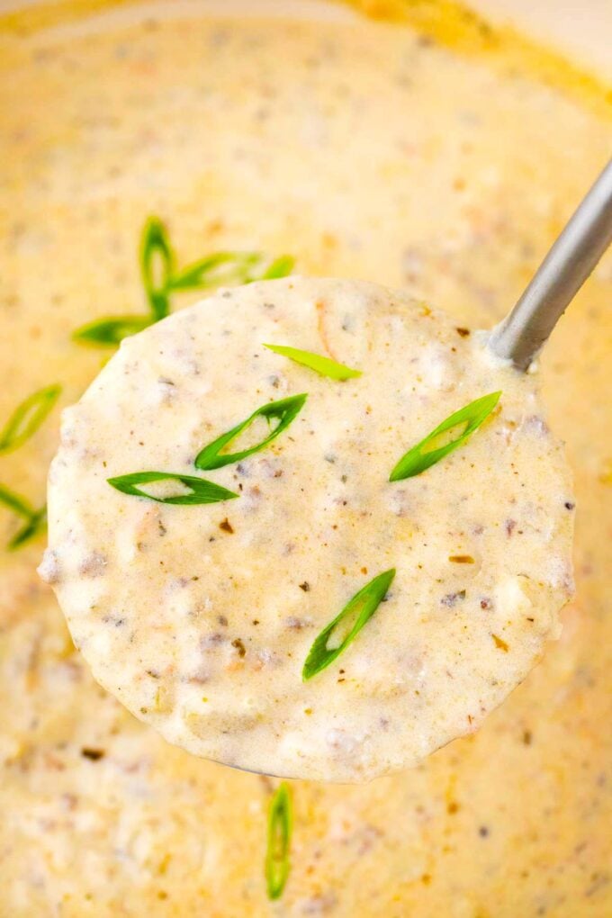 a ladle of very creamy and cheesy cheeseburger soup