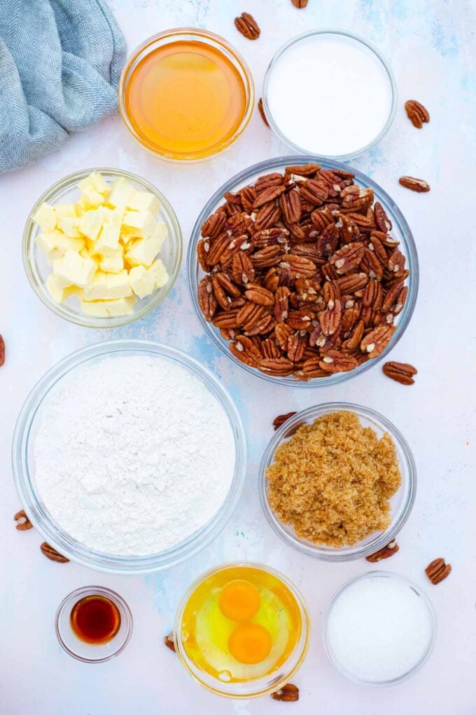 pecan pie bars ingredients in bowls on a table