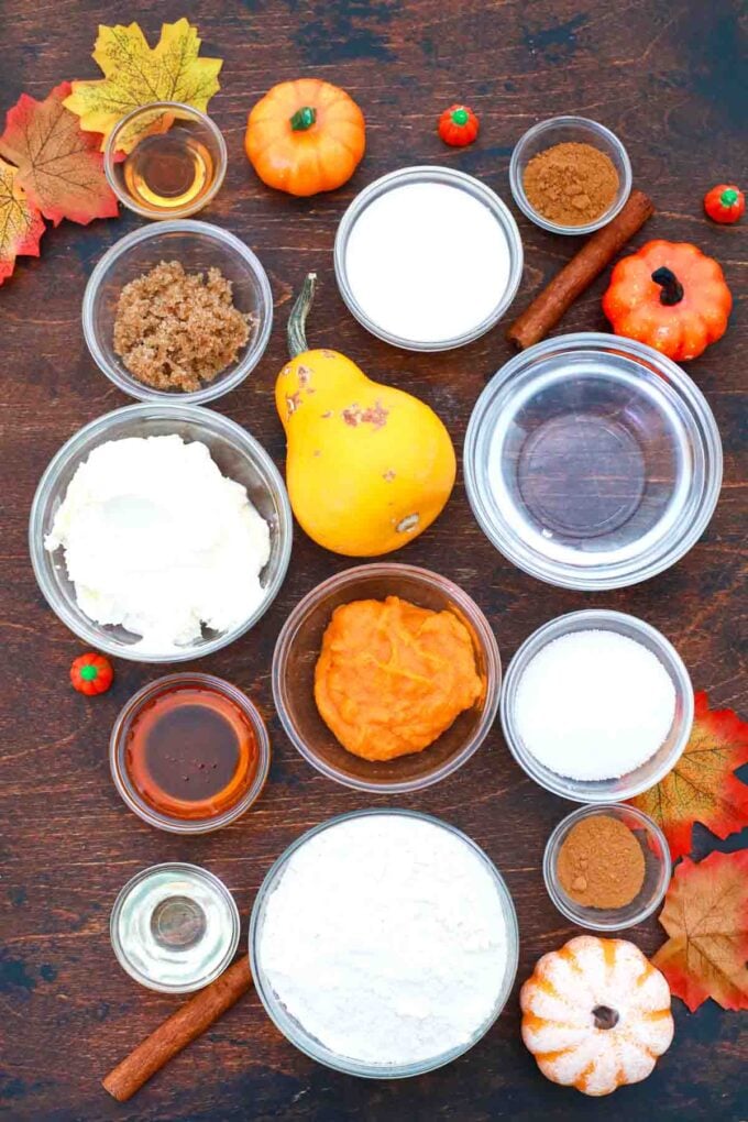 overhead shot of pumpkin puree sugar flour spices on a table