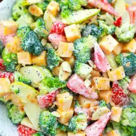 overhead close shot of strawberry broccoli salad with cheese and poppy seeds dressing
