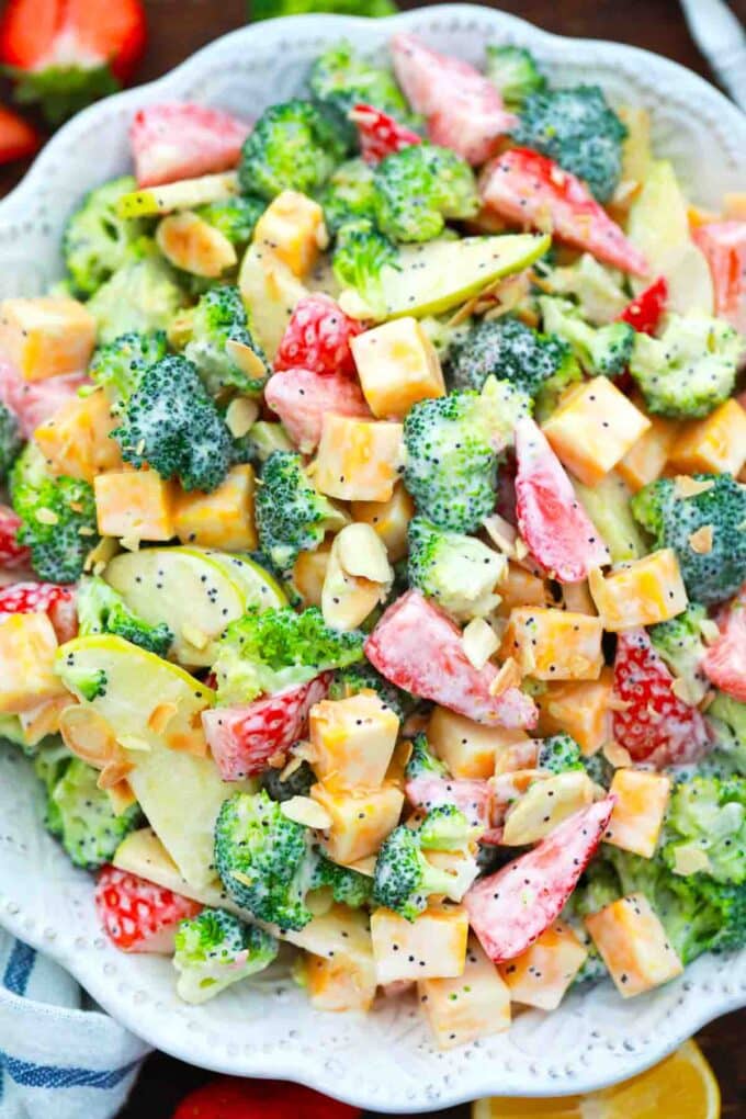 overhead close shot of strawberry broccoli salad with cheese and poppy seeds dressing