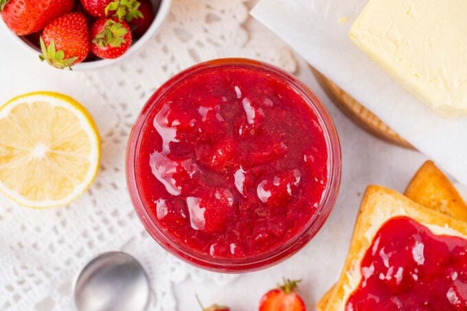 Overhead shot of a jar of homemade strawberry jam.