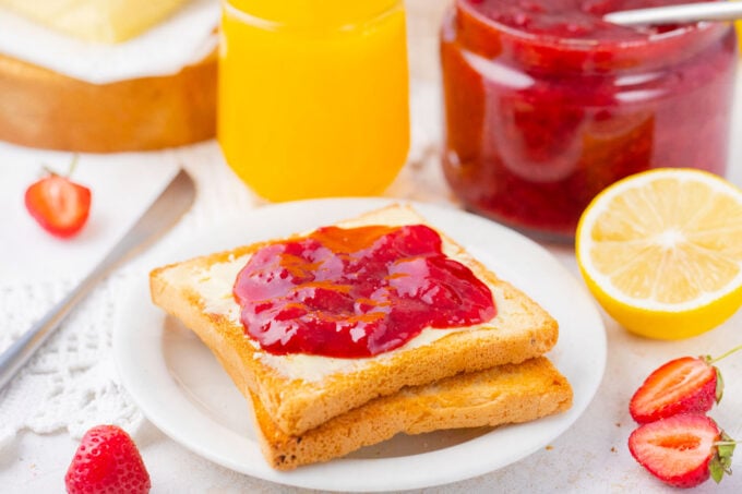 Toast with homemade strawberry jam and lemon juice.