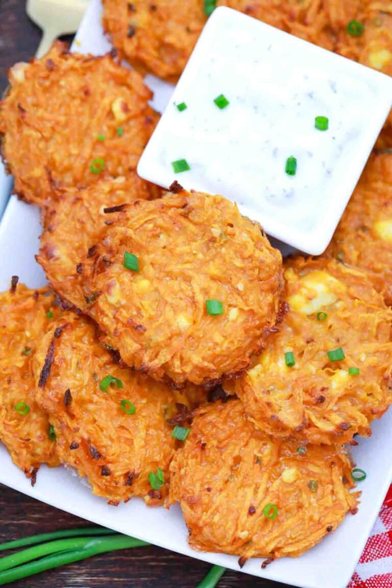 overhead shot of crispy sweet potato fritters with white sauce