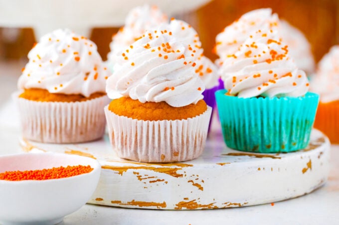 Sweet potato pie cupcakes topped with cinnamon whipped cream.