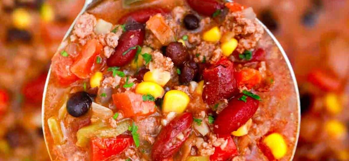 overhead shot of a ladle of taco soup