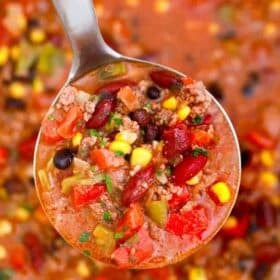 overhead shot of a ladle of taco soup