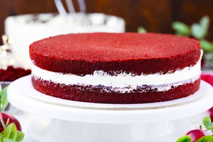 Assembling homemade red velvet cake from scratch.