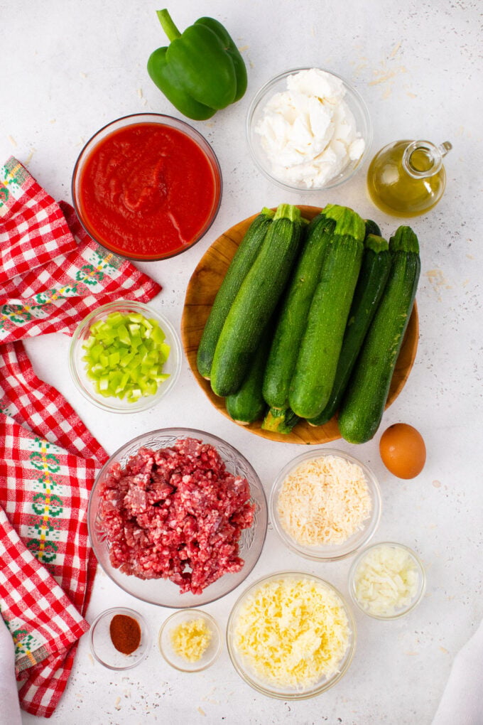 Overhead shot of zucchini lasagna rollups ingredients on a table.